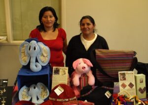 Eva (left) and Ayde at a public meeting at Christ the King Lutheran Church