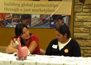 Eva (left) and Ayde at a public meeting at Christ the King Lutheran Church